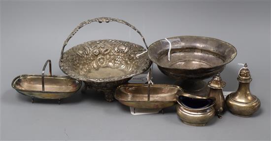 An embossed silver basket, a sterling weighted bowl, a pair of silver trug dishes and three condiments